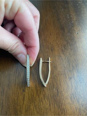 Gold Tone V Shaped Hoop Earrings with a Cubic Zirconia Pavé setting